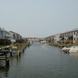 Docks and backyards of houses on the canal