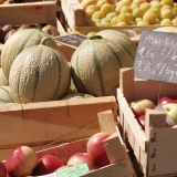 Melons and apples for sale