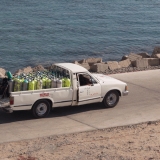 A pick-up truck loaded with compressed air bottles