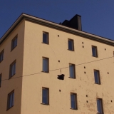 Shoes hanging from an electric wire at Pengerkatu