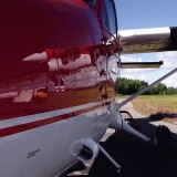 A reflection in a parachuting airplane