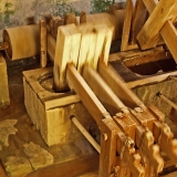 Mallets hammering paper pulp