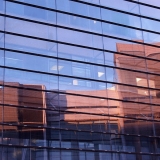 A facade of a glass wall building