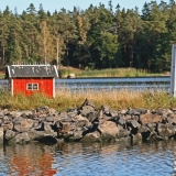 A miniature hut and a lighthouse at the Porkkala sea route