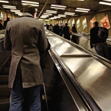 Man on escalator heading to the central railway station