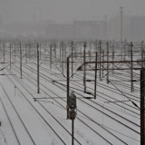 A railway yard during snowfall