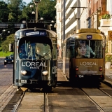 Trams advertising L'oreal passing each other