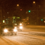 Cars and a tram in a blizzard at Mannerheimintie