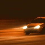 A car in a blizzard at Mannerheimintie