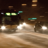 A bus and cars in a blizzard at Mannerheimintie