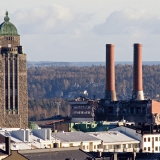 Kallio church bell tower and the power plant at Hanasaari where demolition is underway