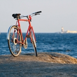 Bicycle on shore rocks