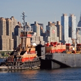 A tugboat and Manhattan skyscrapers