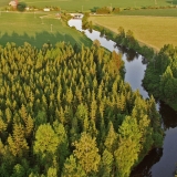 Mntslnjoki river flows through forests and fields