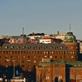 The Arena house and Kallio church, both designed by Lars Sonck, the Hakaniemi market place in the foreground