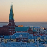 St. John's church rises over the roofs of southern Helsinki