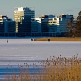 People walking on ice in front of Lehtisaari