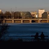 The setting sun reflects from Hakaniemi's buildings to Tlnlahti bay