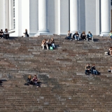 People enjoying a summer day at the steps of the Helsinki cathedral