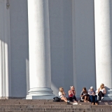 People enjoying a summer day at the steps of the Helsinki cathedral