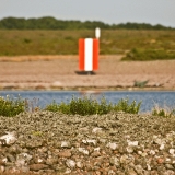 Route marker at a beach