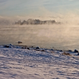 The island of Srkk in sea smoke