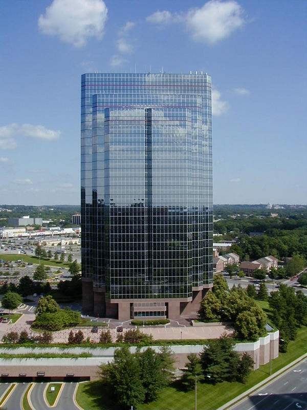 A skyscraper reflects the sky