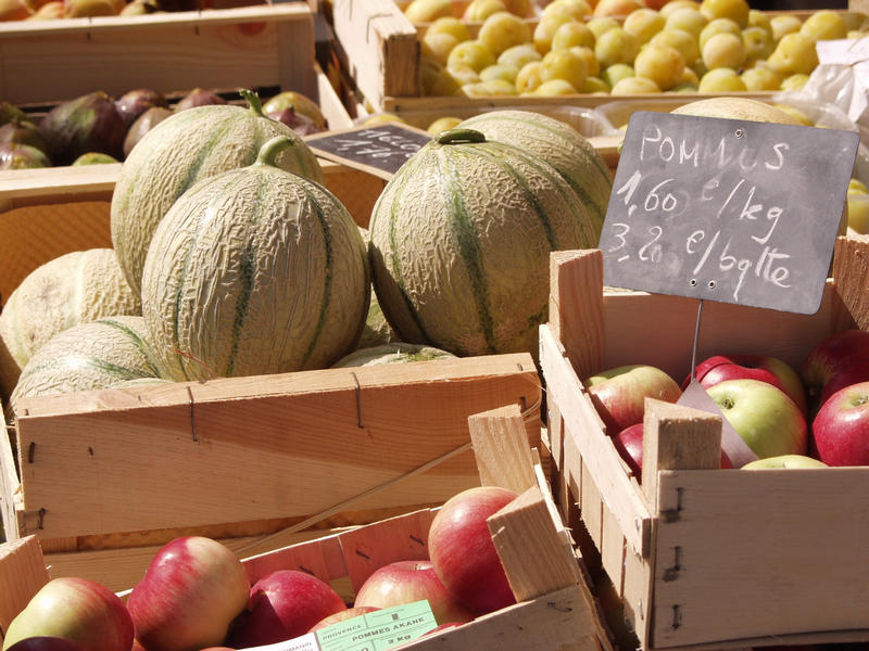 Melons and apples for sale