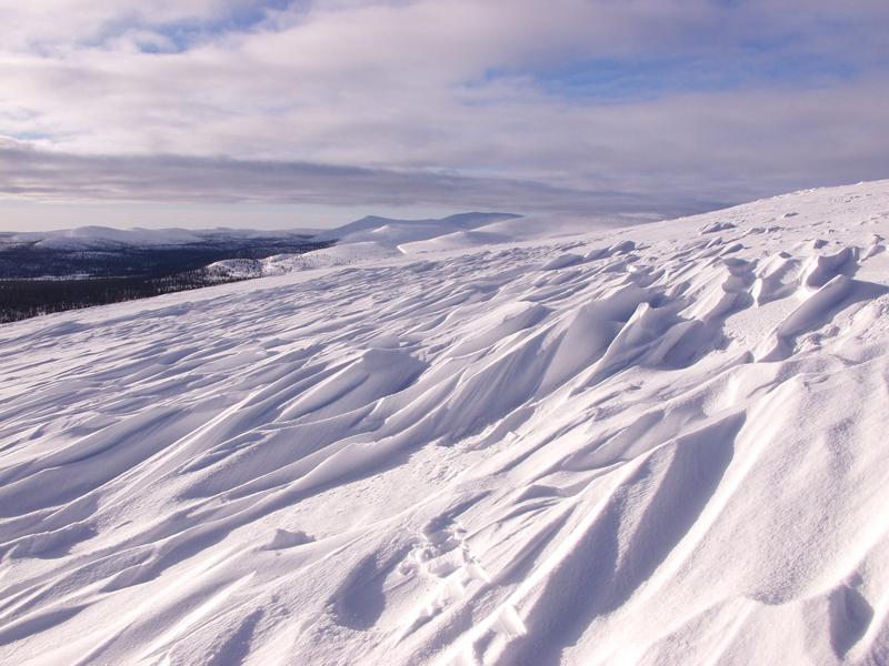 Shapes in the snow on the slope of Vuomap, Saariselk's other hills in the background