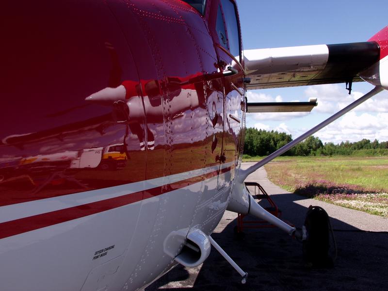 A reflection in a parachuting airplane