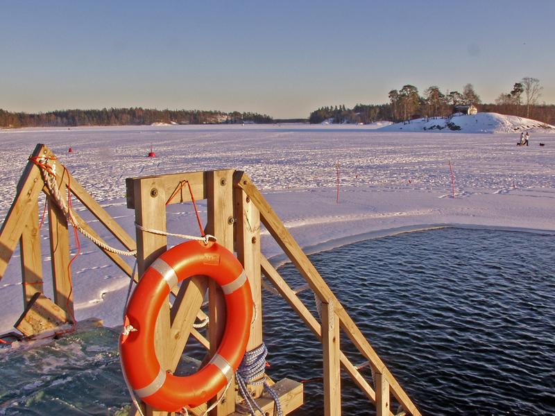 A winter time open water swimming place at Marjaniemi beach, Koivusaari islands in the background