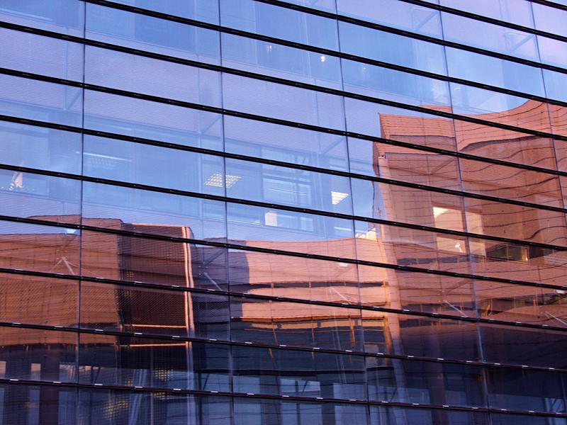 A facade of a glass wall building