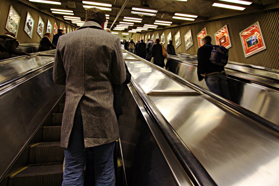 Man on escalator heading to the central railway station