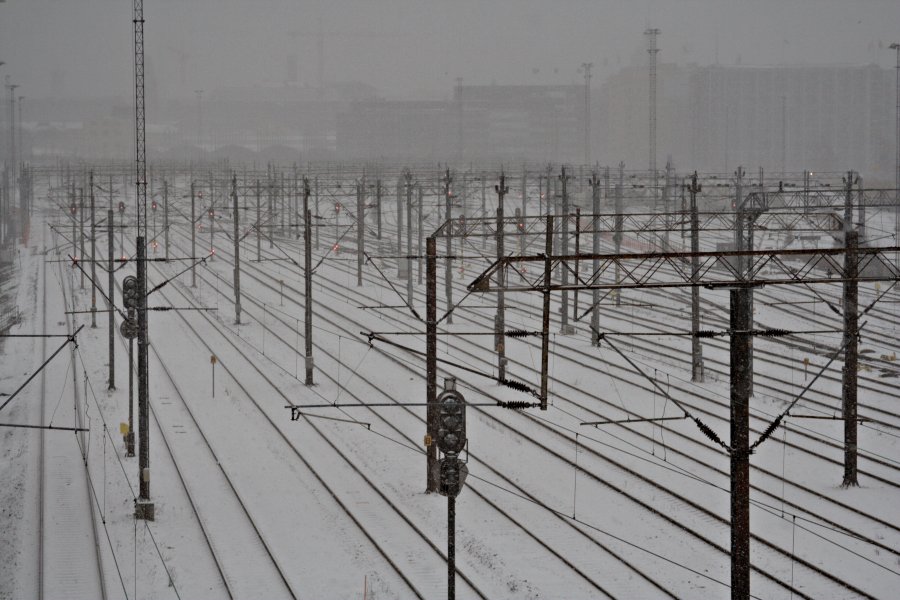 A railway yard during snowfall