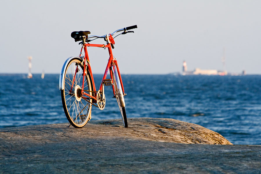 Bicycle on shore rocks