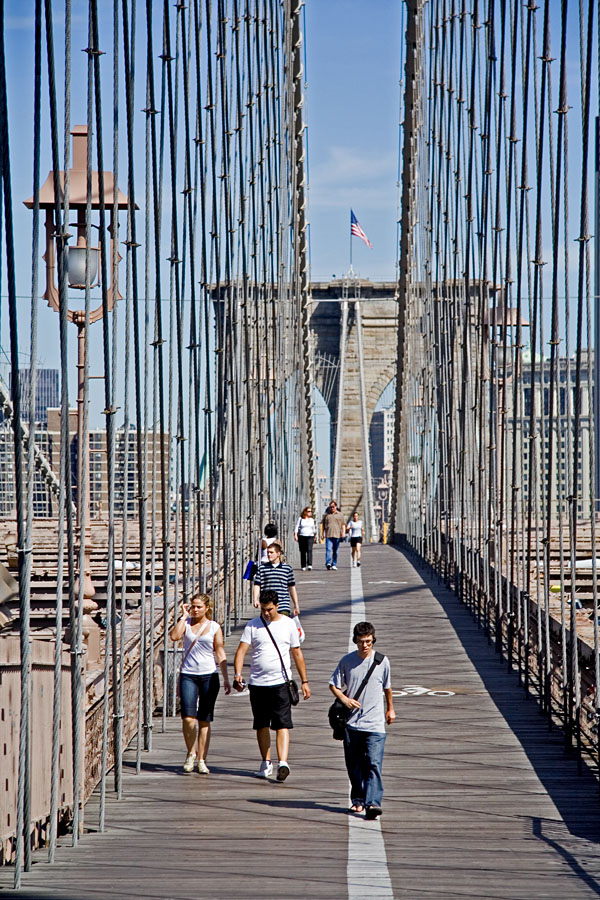 People walking on Brooklyn bridge